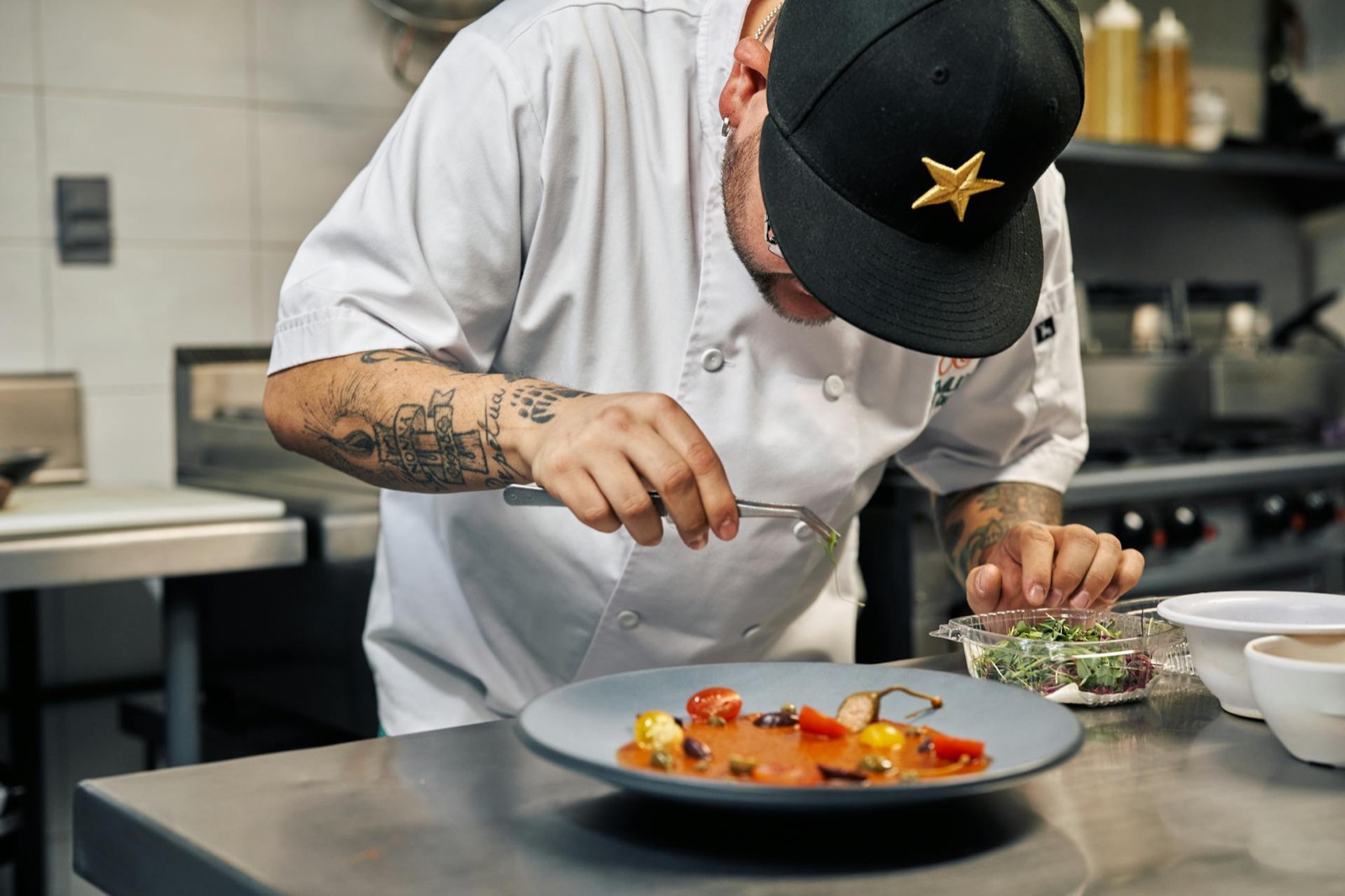 Hand-plating with tweezers — every course at Bosq is finished by hand